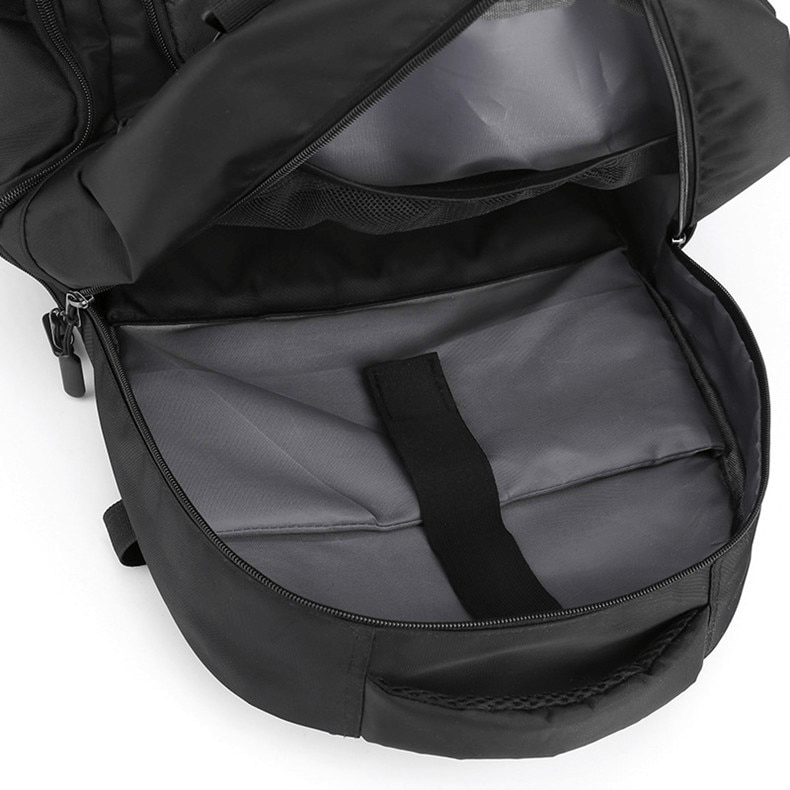 Open sports backpack showing shoe compartment and interior lining, perfect for organizing gear. Unisex design, practical features.